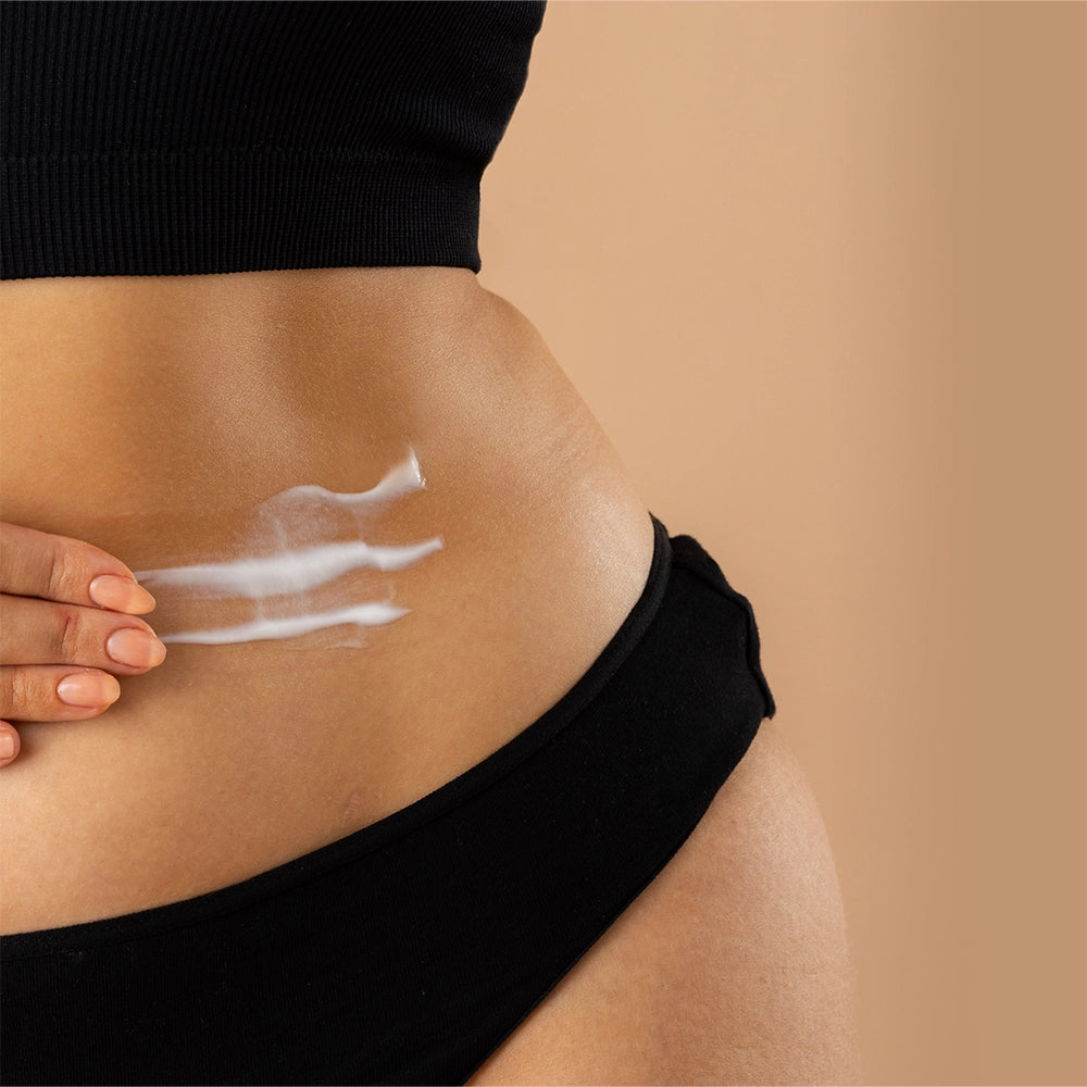 Model using Body Glow Gradual Tanning Lotion